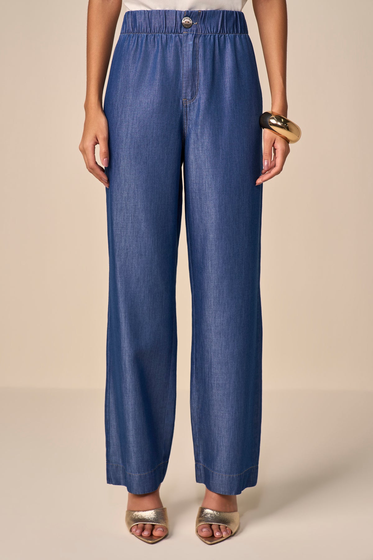 calça jeans reta cintura intermediária cós de elástico