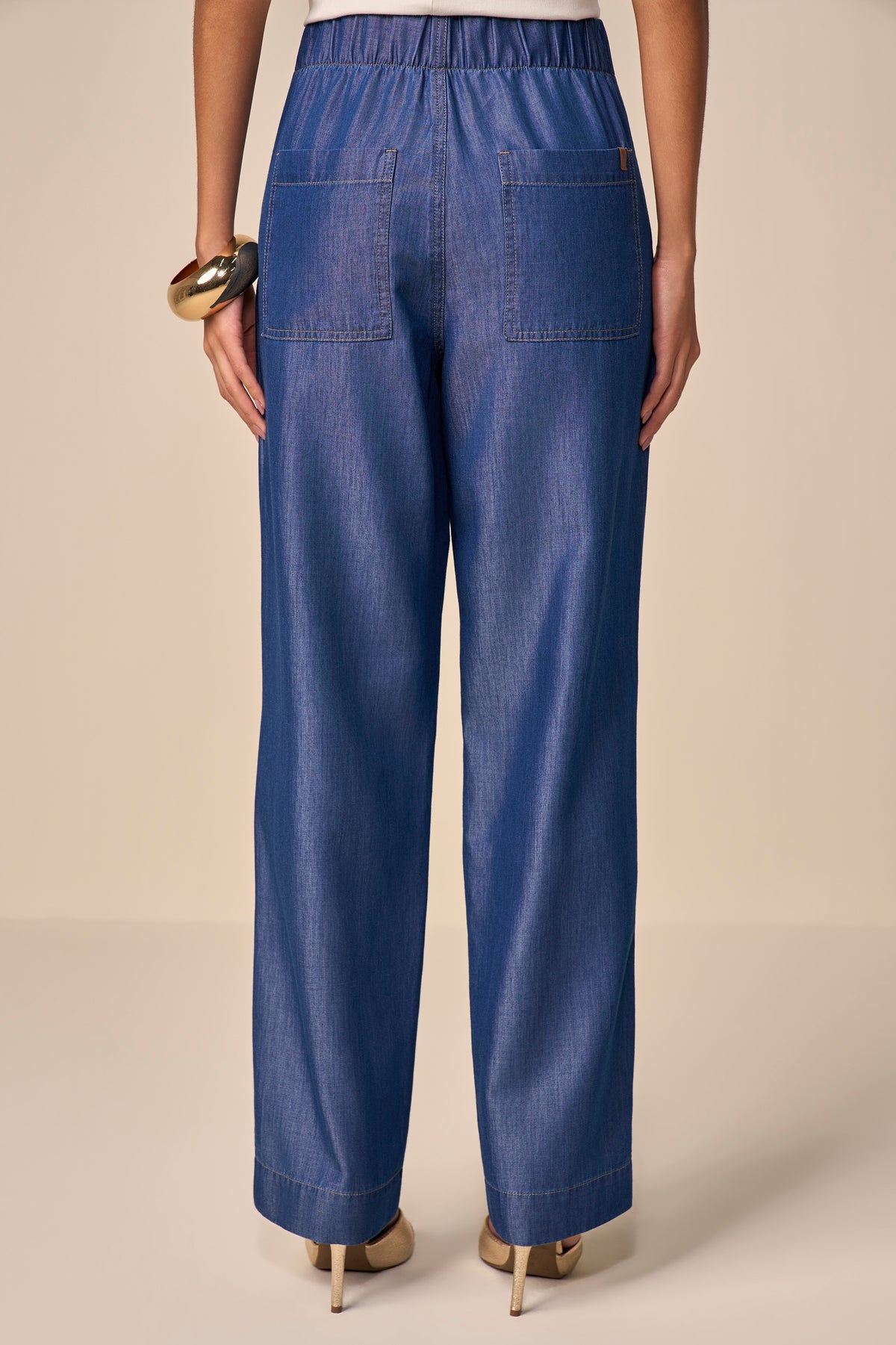 calça jeans reta cintura intermediária cós de elástico